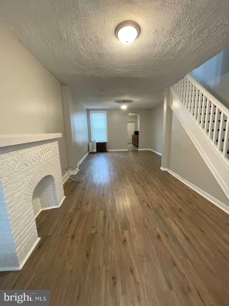 1623 Carswell Street Baltimore, MD 21218 - Photo 3 of 16 Living room into dining room