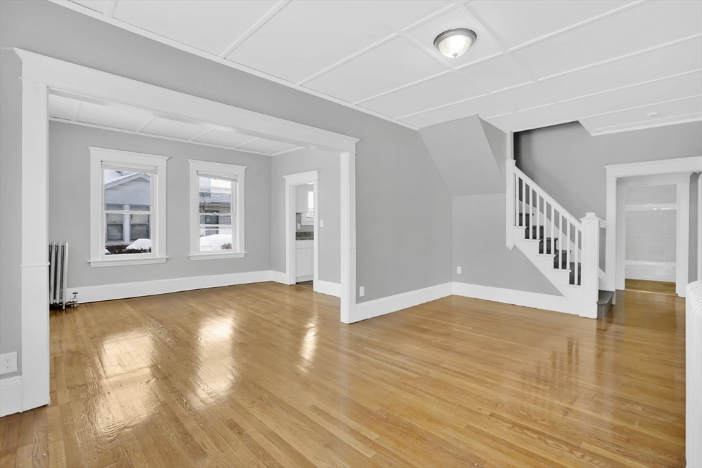 11 Ina Street Springfield, MA 01109 - Photo 12 of 23 a view of an empty room with window and wooden floor