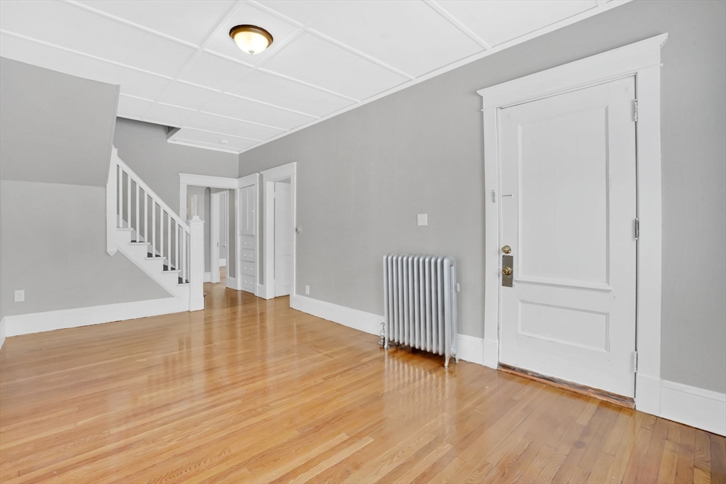 11 Ina Street Springfield, MA 01109 - Photo 13 of 23 a view of empty room with wooden floor