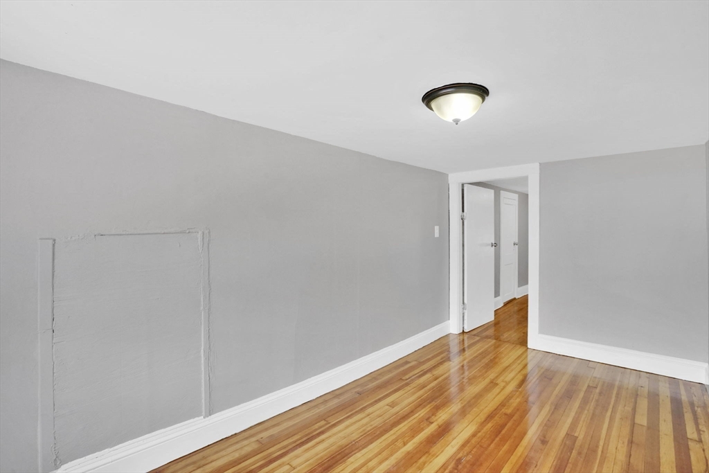 11 Ina Street Springfield, MA 01109 - Photo 22 of 23 a view of empty room with wooden floor