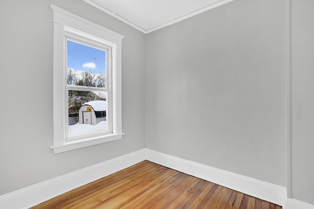 11 Ina Street Springfield, MA 01109 - Photo 9 of 23 a view of a small space with wooden floor and a window