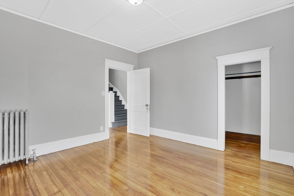11 Ina Street Springfield, MA 01109 - Photo 10 of 23 a view of empty room with wooden floor
