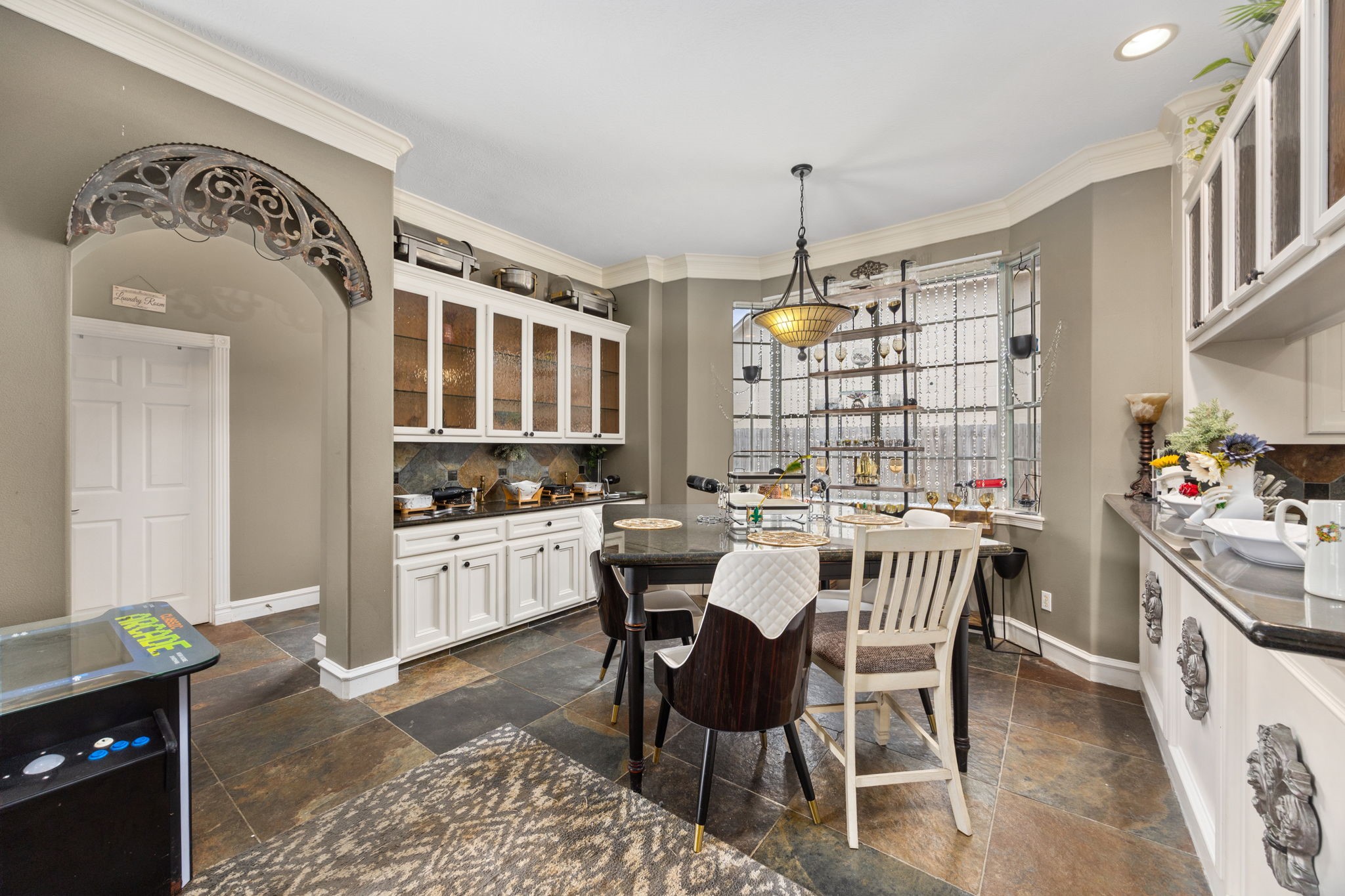 13307 Cypress Pond Road Cypress, TX 77429 - Photo 14 of 50 a kitchen with a dining table chairs stainless steel appliances and cabinets