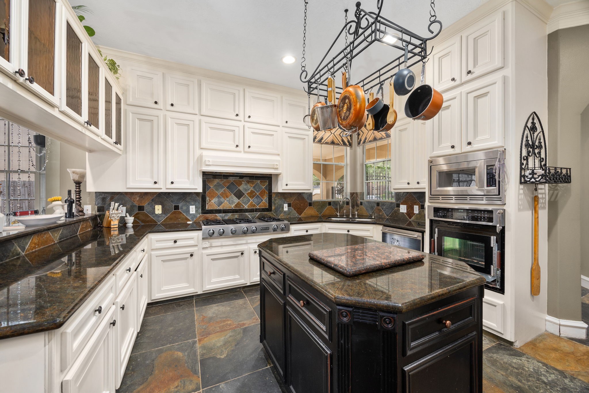 13307 Cypress Pond Road Cypress, TX 77429 - Photo 16 of 50 a kitchen with stainless steel appliances granite countertop a stove and a sink