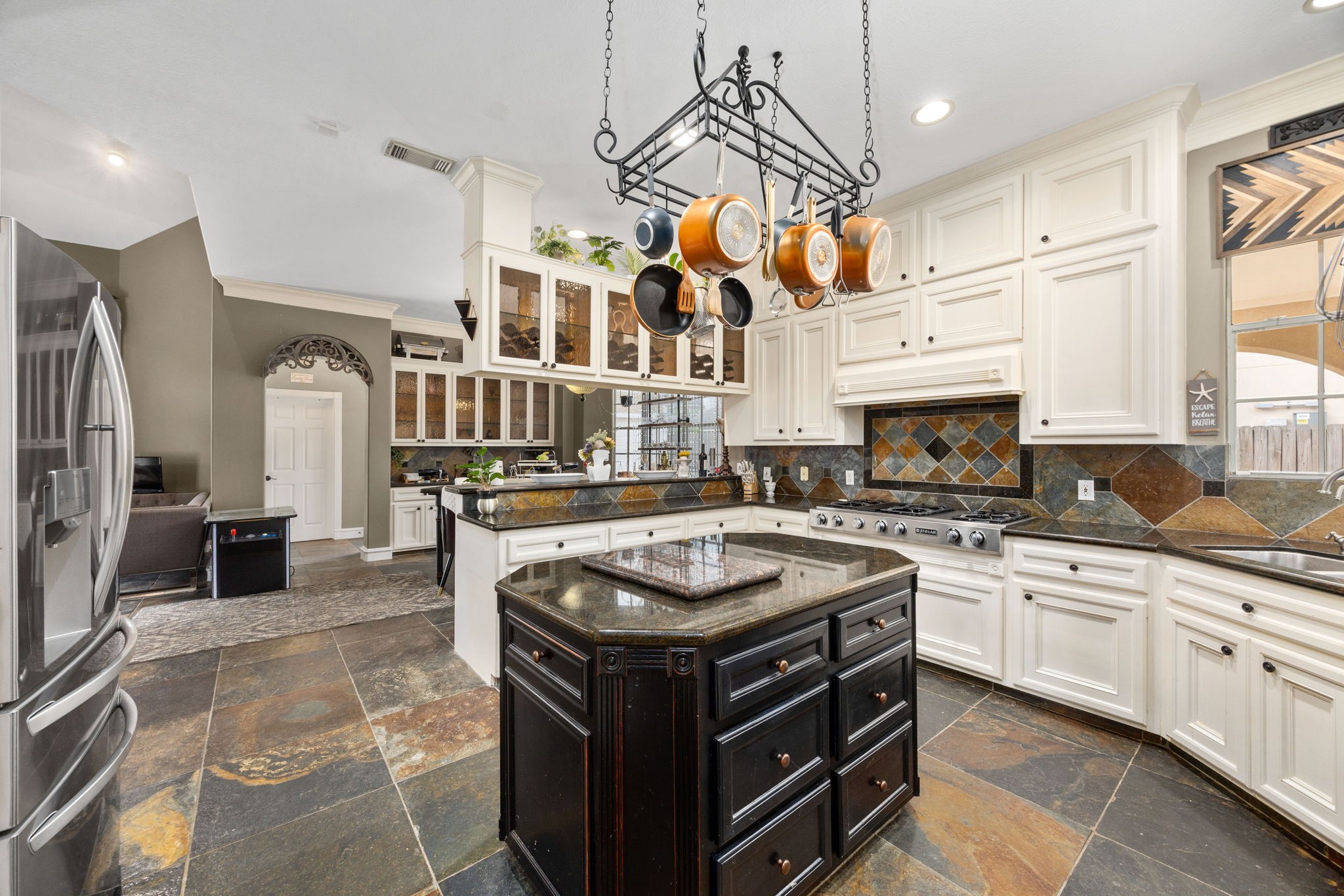 13307 Cypress Pond Road Cypress, TX 77429 - Photo 17 of 50 a kitchen with stainless steel appliances granite countertop a stove a sink and a refrigerator