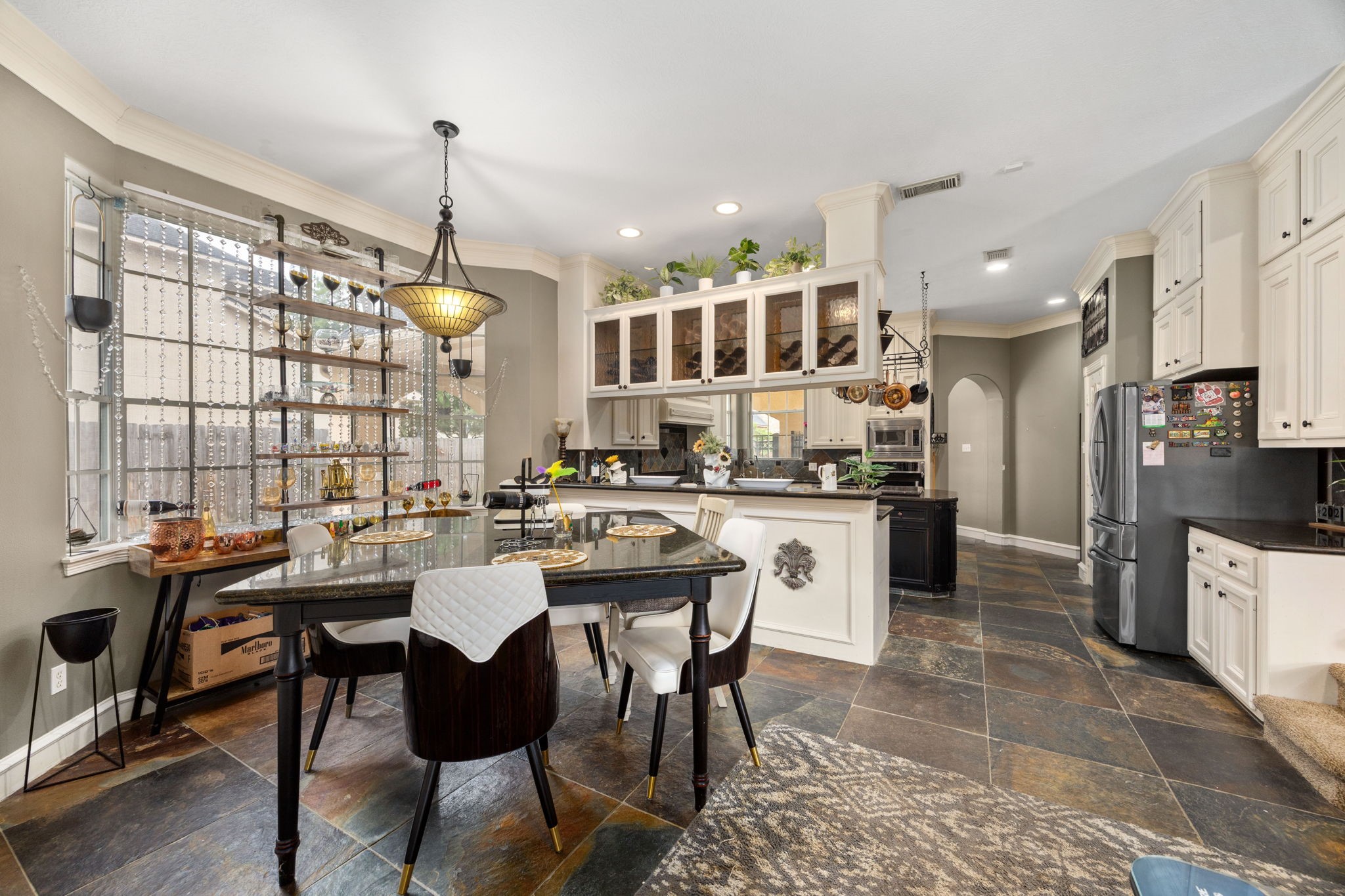 13307 Cypress Pond Road Cypress, TX 77429 - Photo 19 of 50 a kitchen with stainless steel appliances kitchen island granite countertop a sink and cabinets