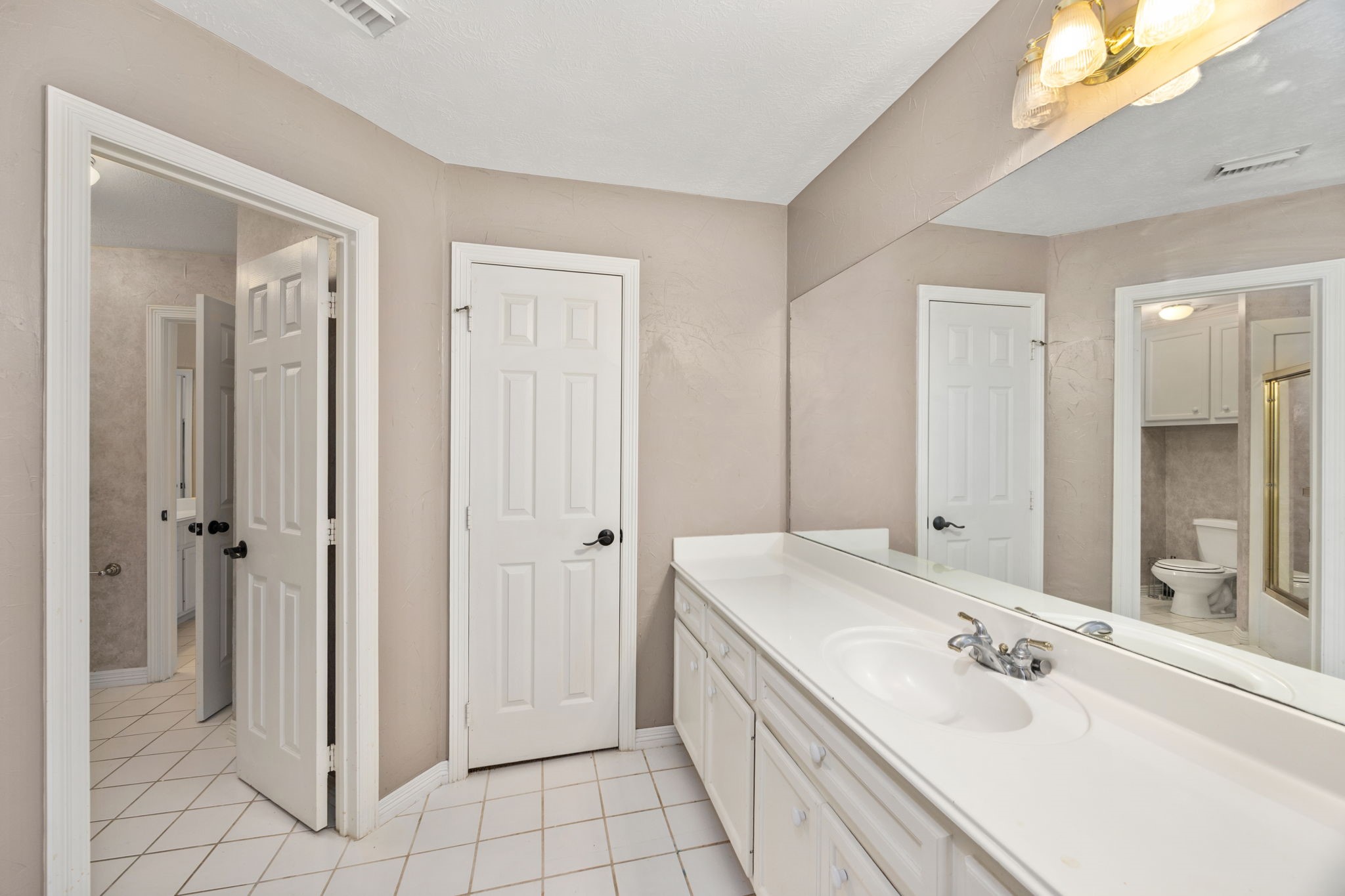 13307 Cypress Pond Road Cypress, TX 77429 - Photo 24 of 50 a bathroom with a double vanity sink mirror and