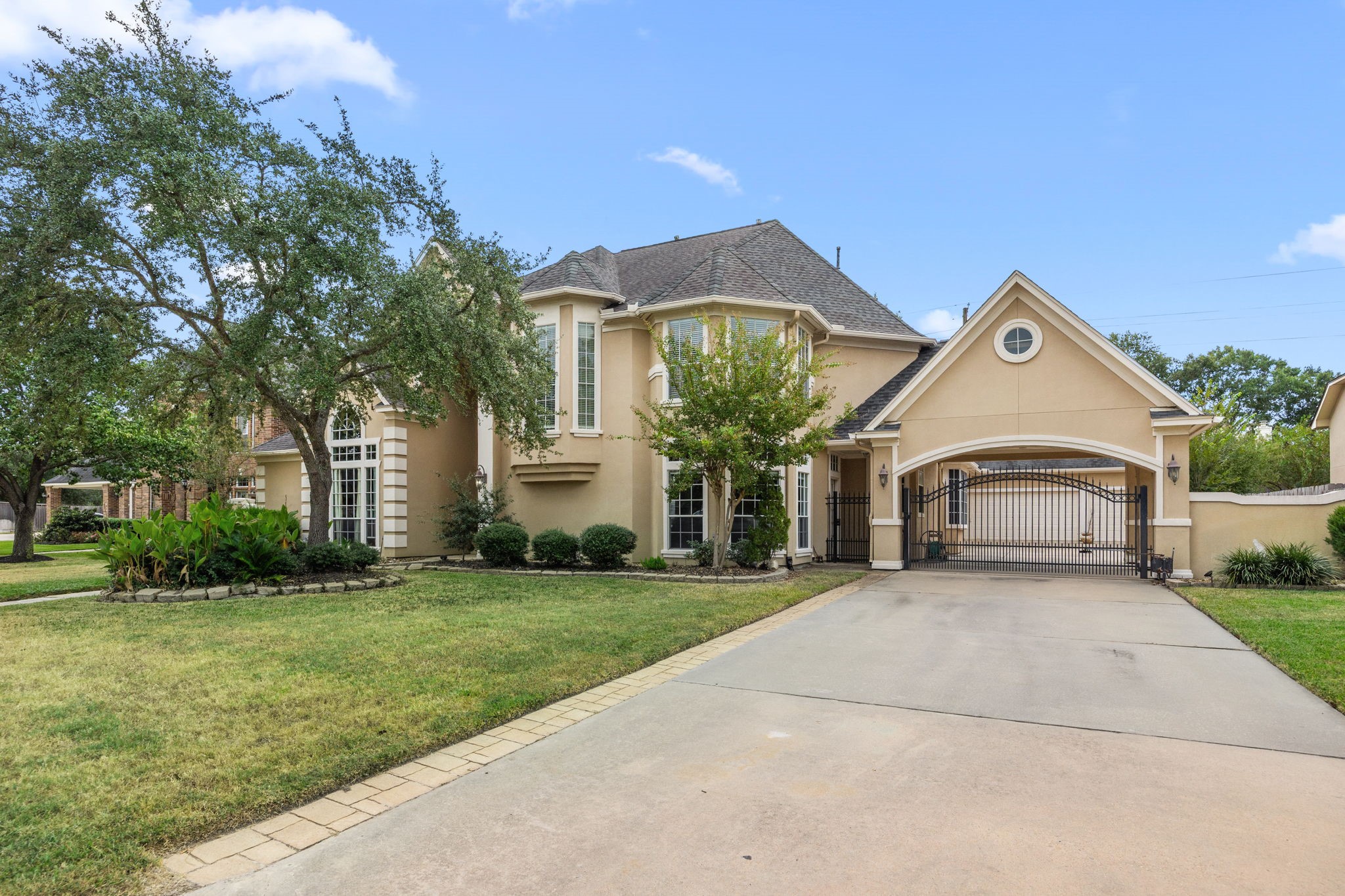 13307 Cypress Pond Road Cypress, TX 77429 - Photo 3 of 50 a front view of a house with a garden and trees