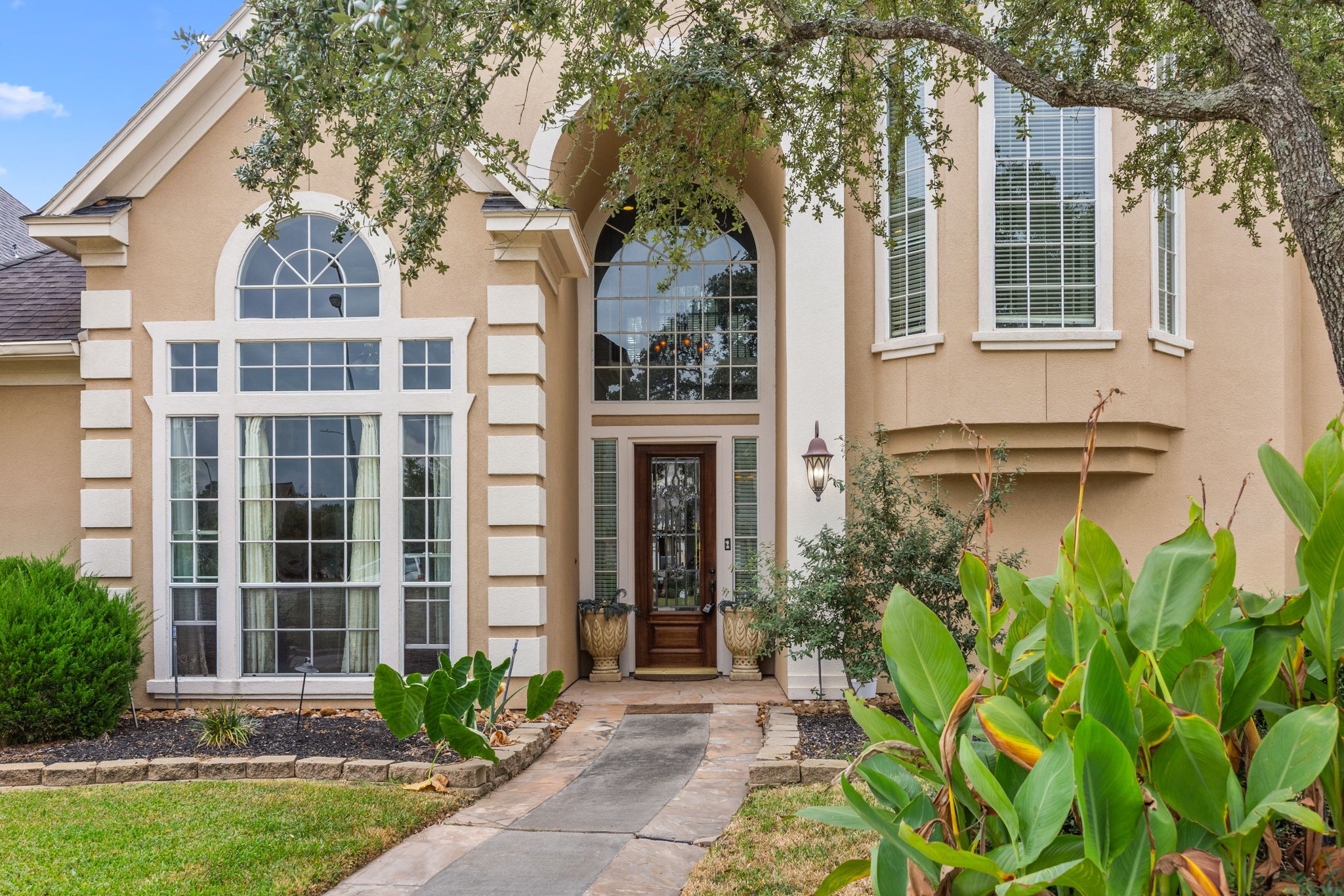 13307 Cypress Pond Road Cypress, TX 77429 - Photo 5 of 50 a front view of a house with a garden