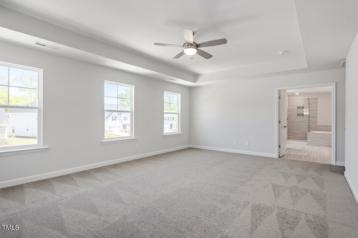 119 Augusta Pond Way, Unit 147 Raleigh, NC 27603 - Photo 14 of 37 a view of an empty room with a window
