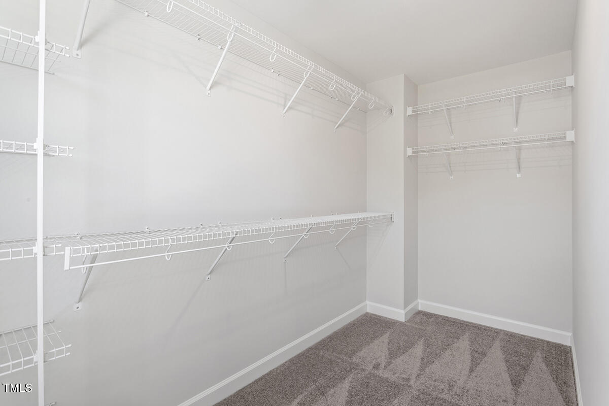 119 Augusta Pond Way, Unit 147 Raleigh, NC 27603 - Photo 17 of 37 a view of a room with racks on the wall