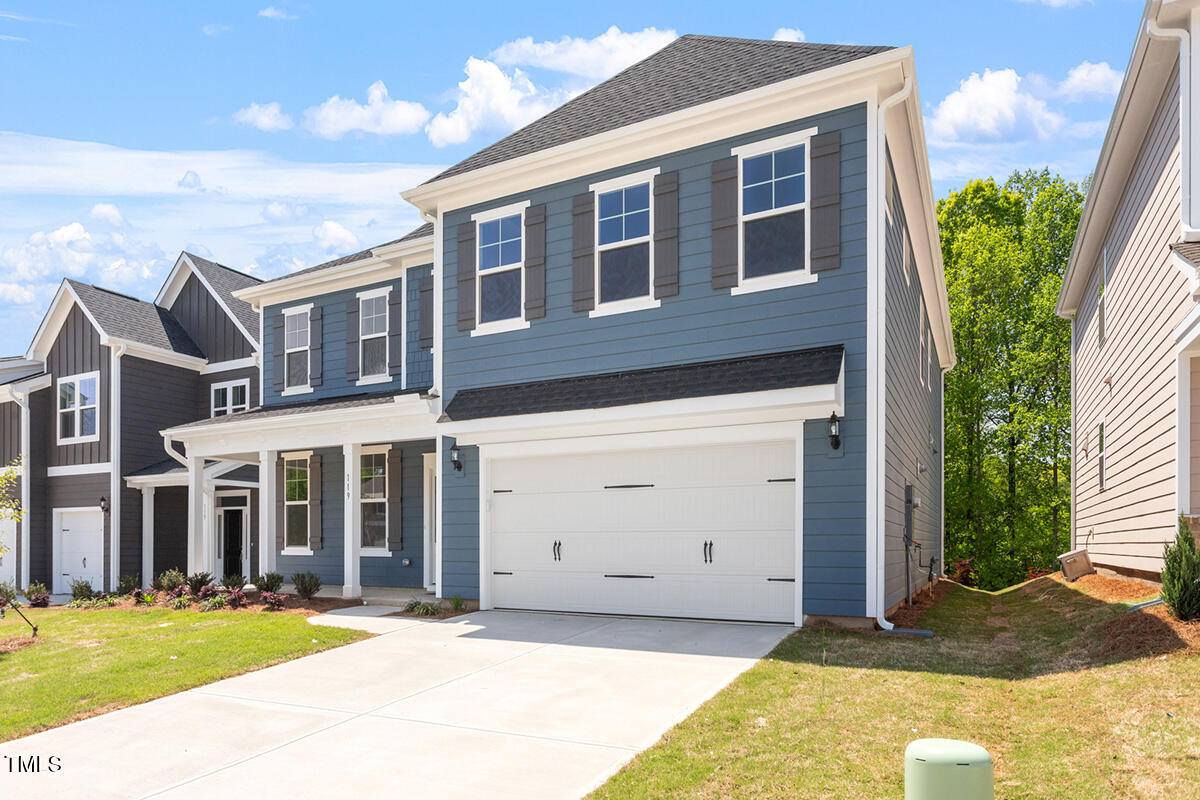 119 Augusta Pond Way, Unit 147 Raleigh, NC 27603 - Photo 2 of 37 a front view of a house with a yard