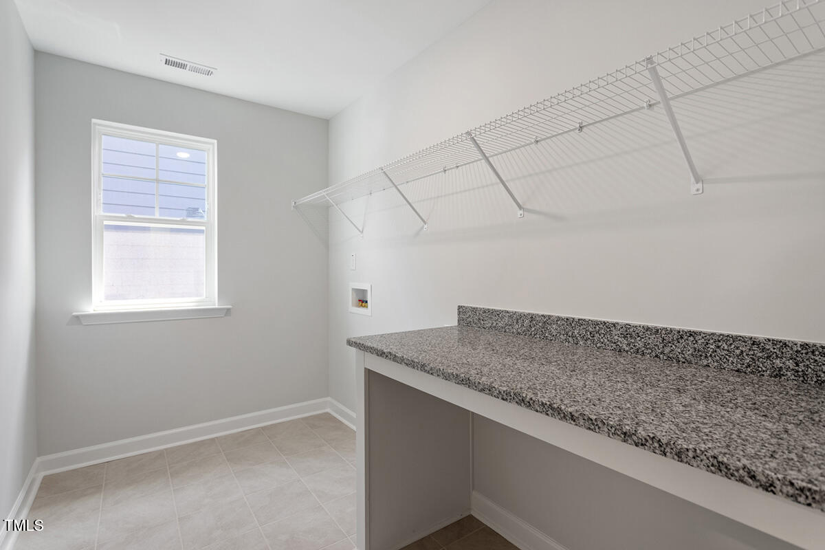 119 Augusta Pond Way, Unit 147 Raleigh, NC 27603 - Photo 28 of 37 a view of storage and utility room with window