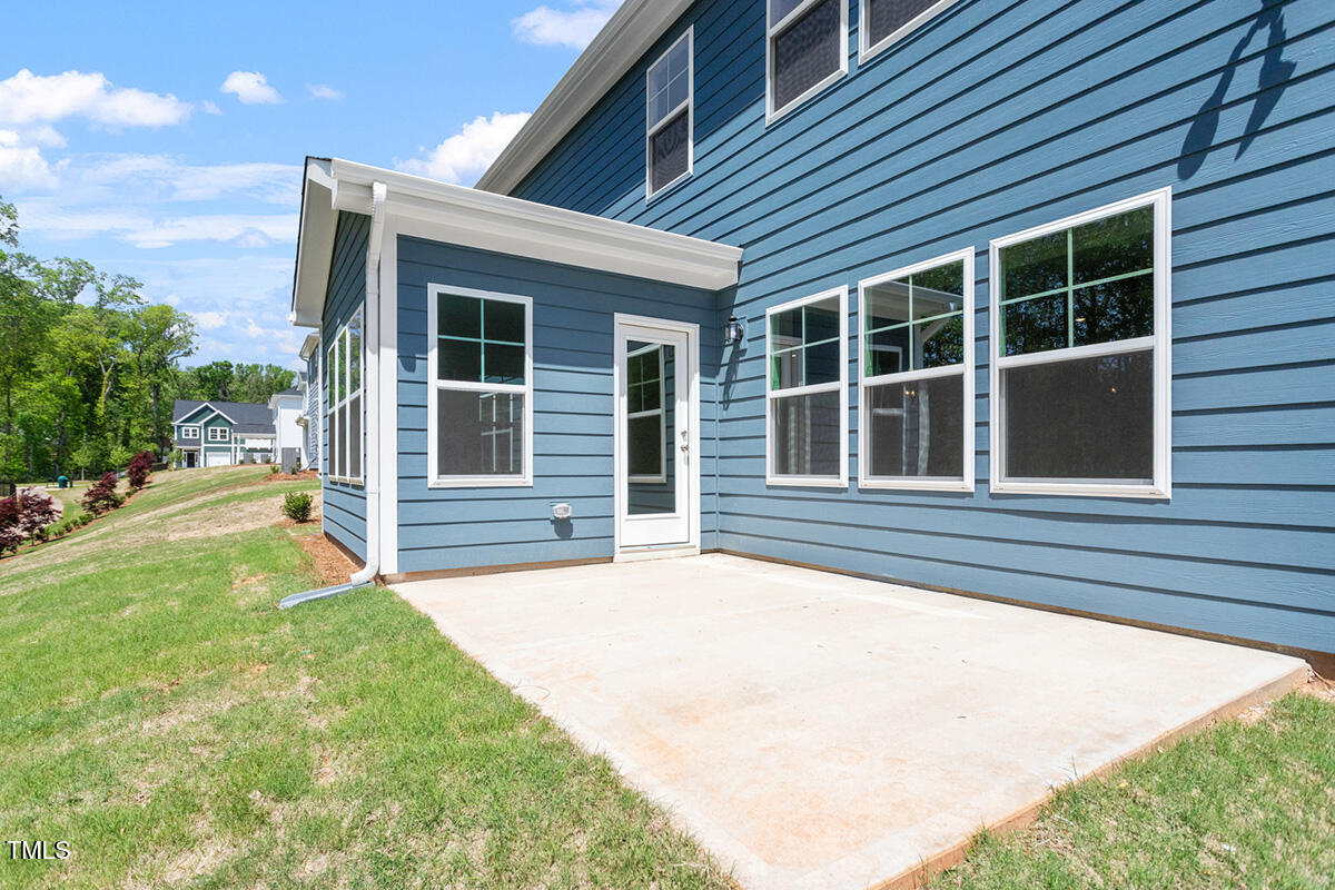 119 Augusta Pond Way, Unit 147 Raleigh, NC 27603 - Photo 29 of 37 a view of a house with backyard and porch