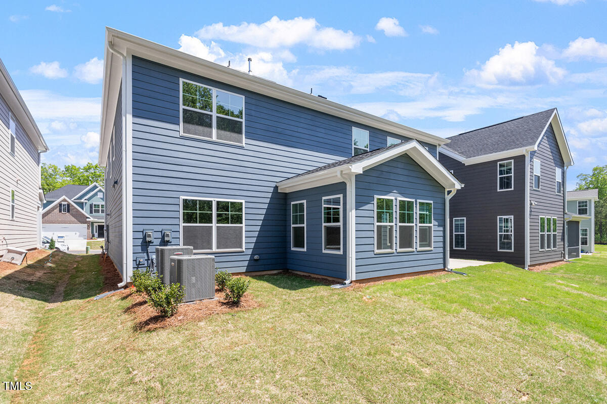 119 Augusta Pond Way, Unit 147 Raleigh, NC 27603 - Photo 30 of 37 a view of a house with a patio