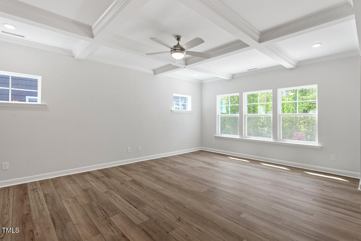 119 Augusta Pond Way, Unit 147 Raleigh, NC 27603 - Photo 9 of 37 wooden floor in an empty room with a window