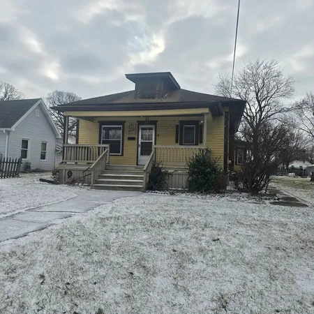 a front view of a house with garage