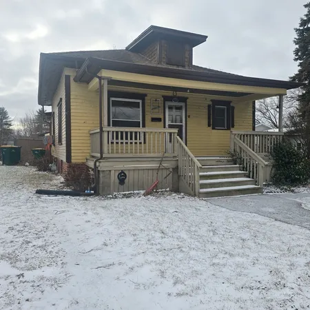 a front view of a house with a fence