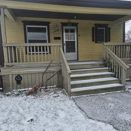 a view of a house with backyard and deck