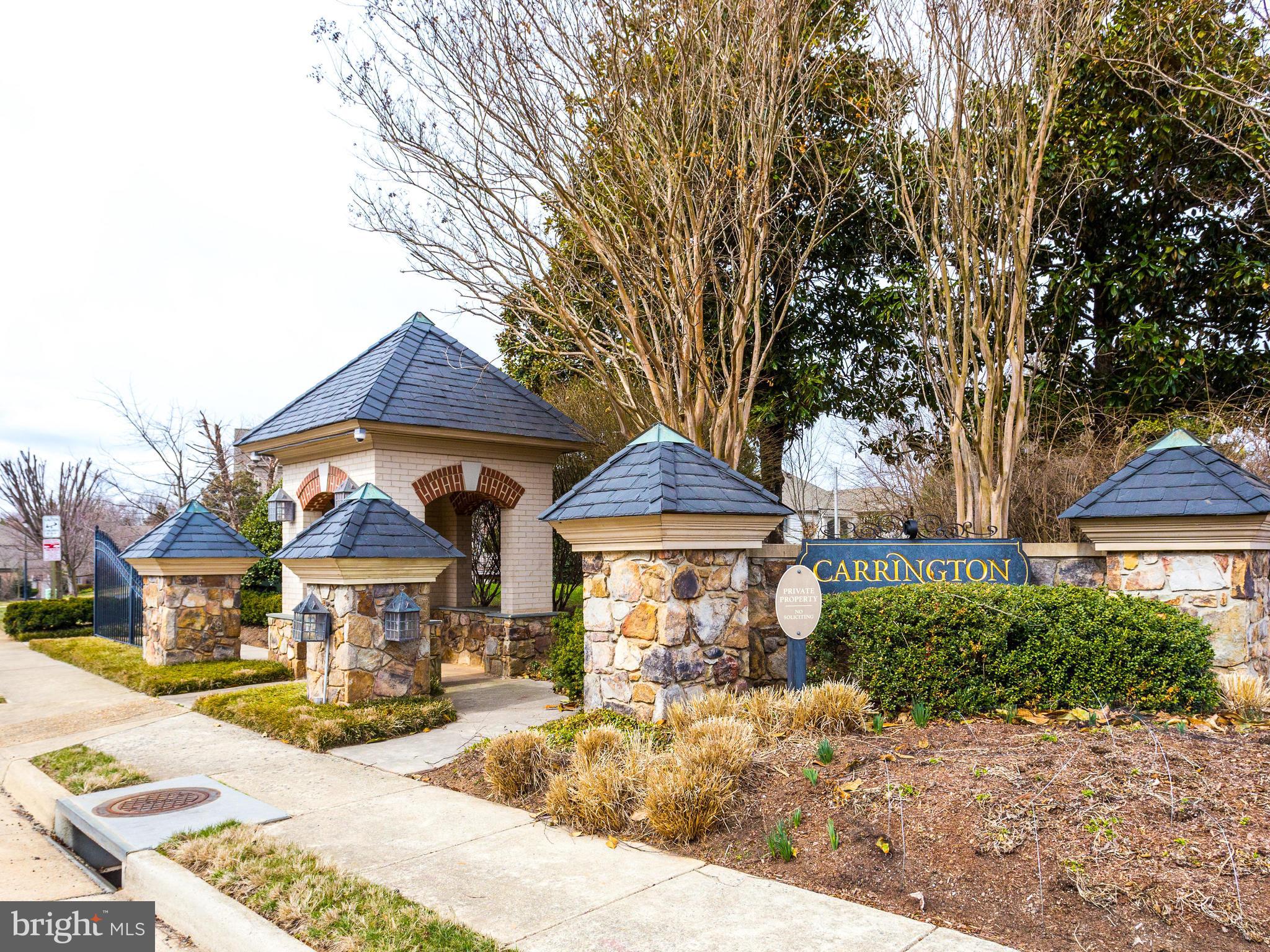 1406 Stanbridge Place Vienna, VA 22182 - Photo 2 of 30 a front view of a house with a yard