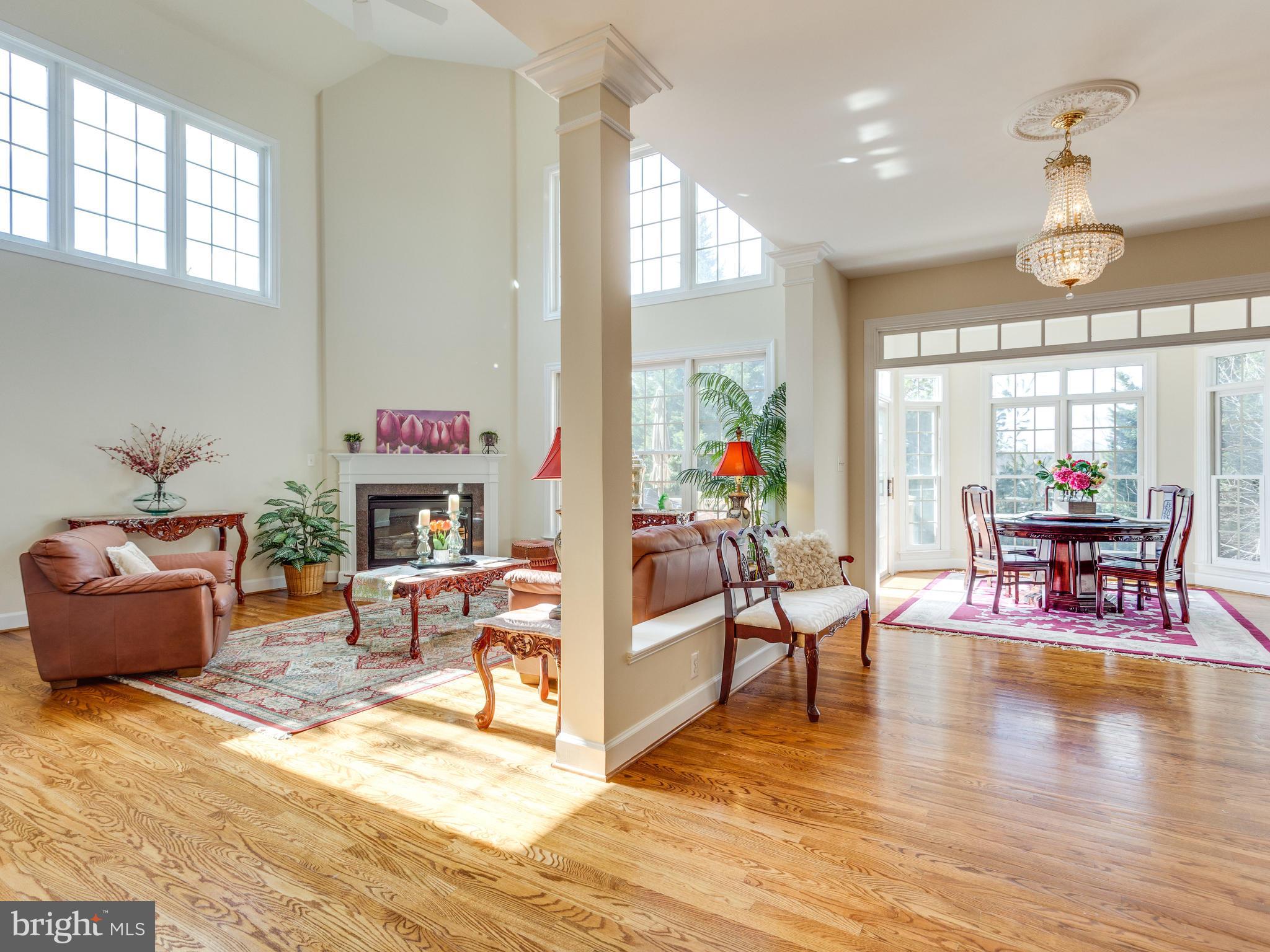 1406 Stanbridge Place Vienna, VA 22182 - Photo 11 of 30 a living room with furniture and a wooden floor