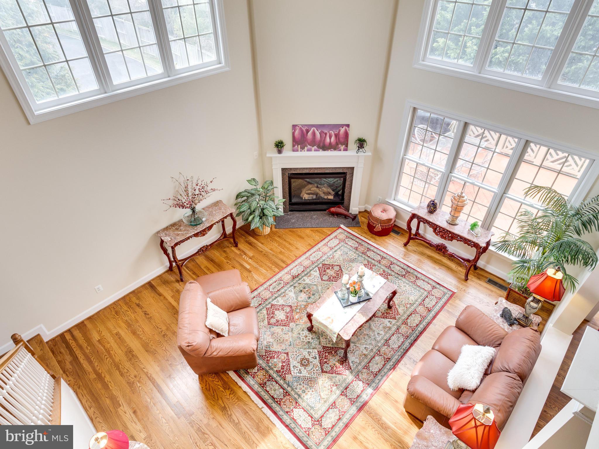 1406 Stanbridge Place Vienna, VA 22182 - Photo 15 of 30 a living room with furniture and a fireplace