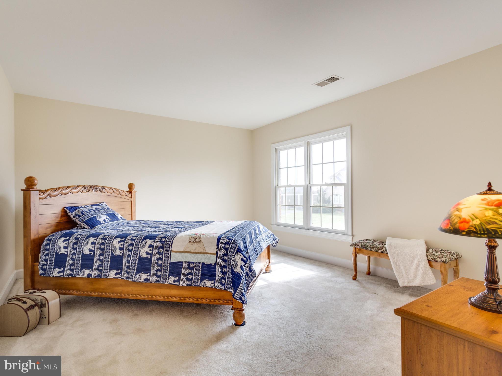 1406 Stanbridge Place Vienna, VA 22182 - Photo 20 of 30 a bedroom with a bed and a window
