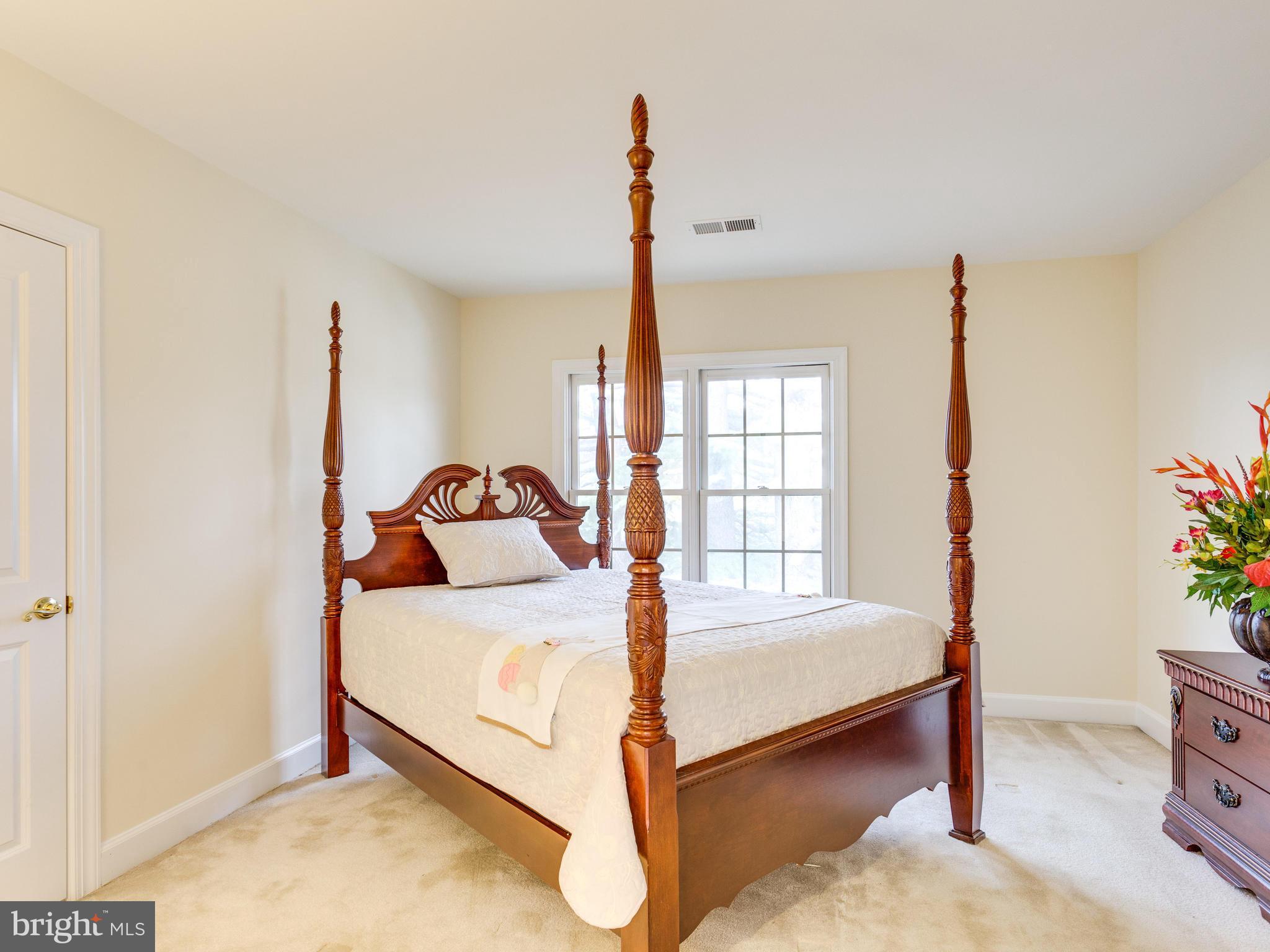1406 Stanbridge Place Vienna, VA 22182 - Photo 22 of 30 a bedroom with a bed and a window
