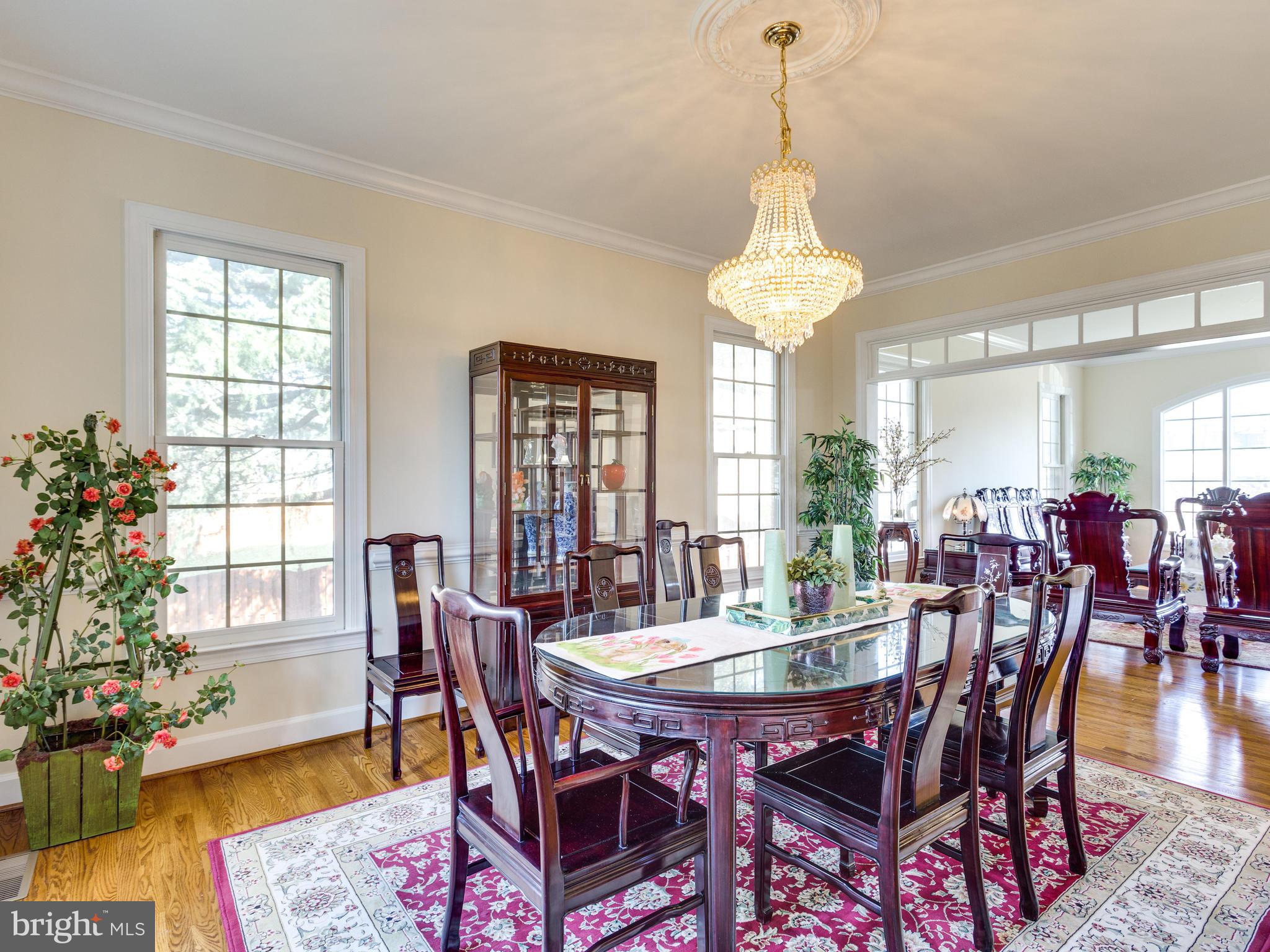 1406 Stanbridge Place Vienna, VA 22182 - Photo 7 of 30 a dining room with furniture window and wooden floor