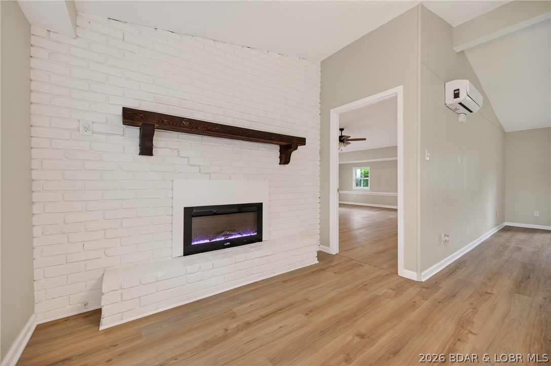 177 Storage Road Eldon, MO 65026 - Photo 12 of 34 The natural wood mantel creates a lovely contrast