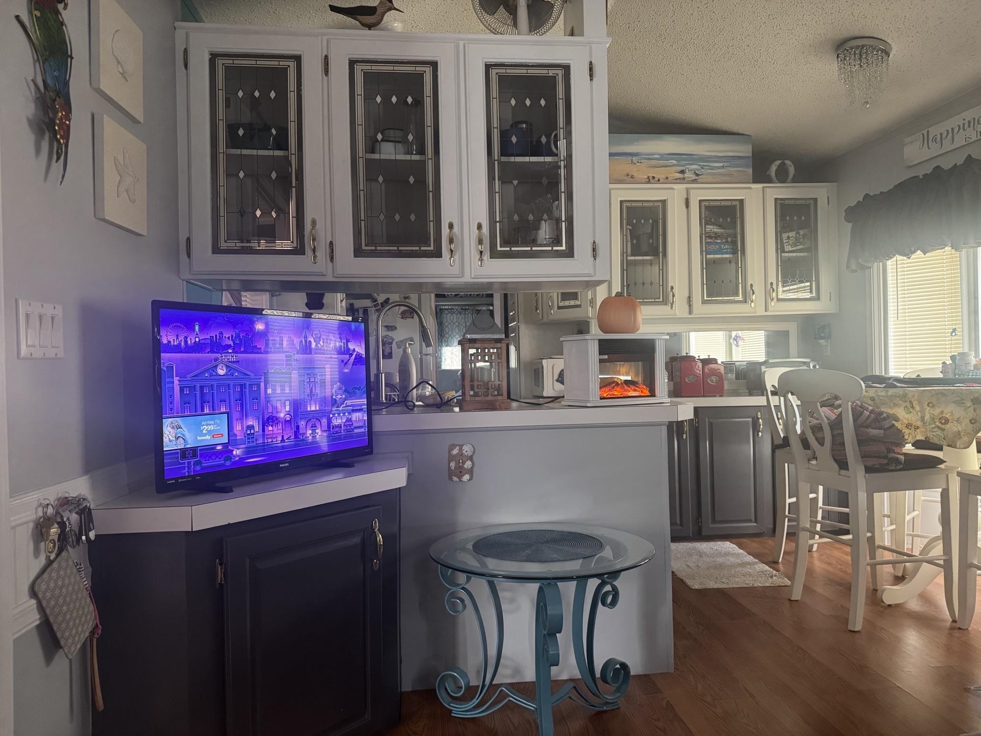 709 Us Rt 9 S, Unit 636 Cape May, NJ 08204 - Photo 5 of 12 a kitchen with stainless steel appliances a dining table and chairs