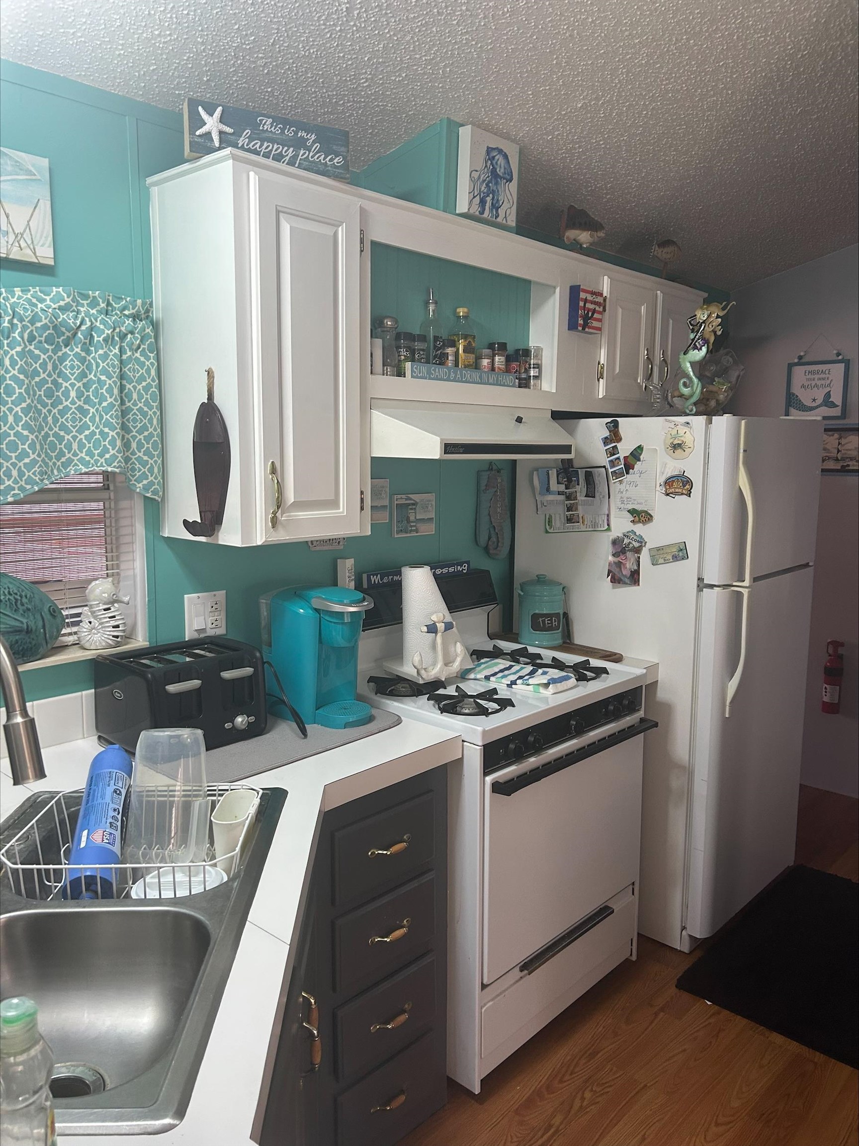 709 Us Rt 9 S, Unit 636 Cape May, NJ 08204 - Photo 6 of 12 a kitchen with stainless steel appliances granite countertop a sink stove and refrigerator