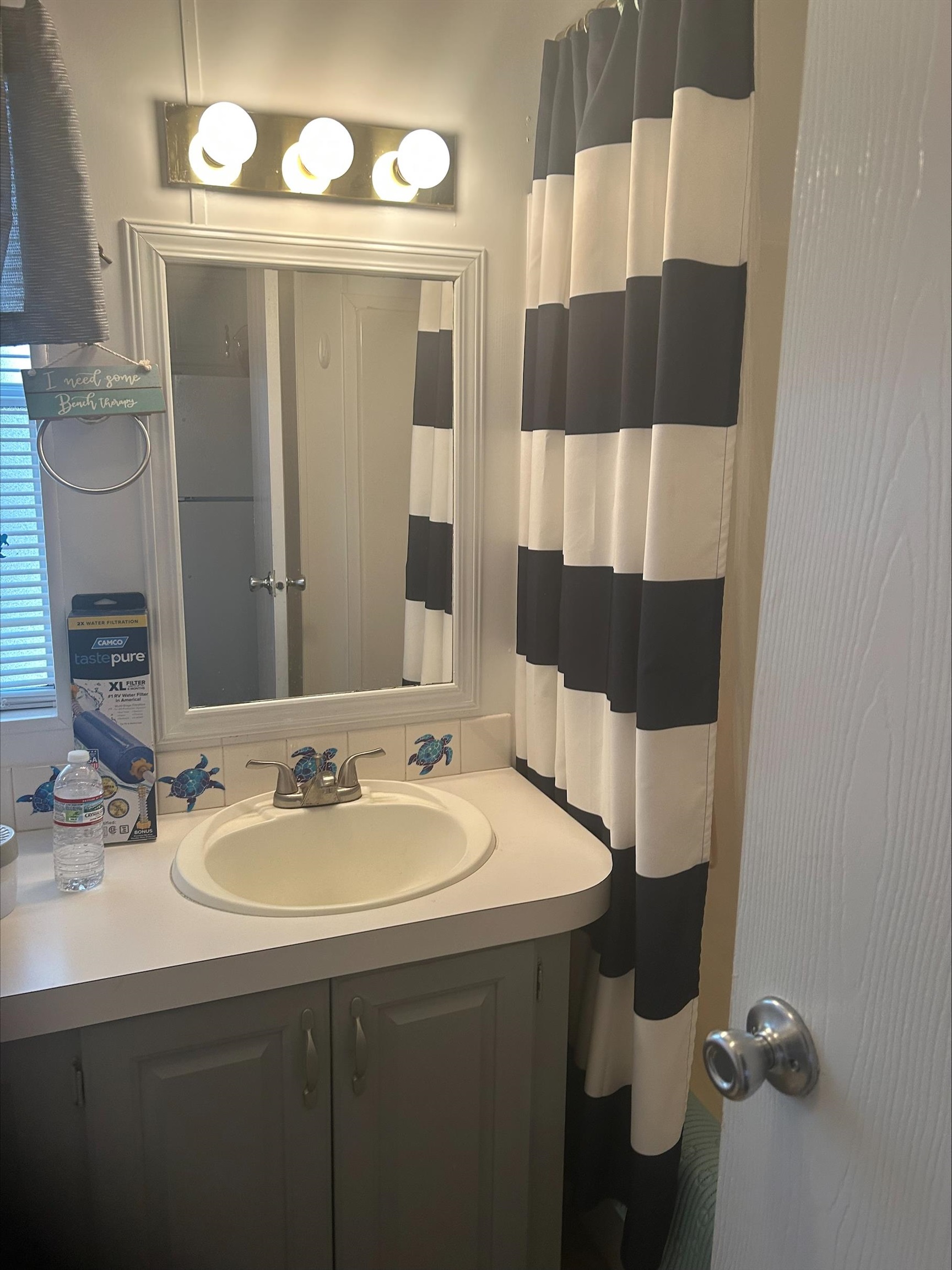 709 Us Rt 9 S, Unit 636 Cape May, NJ 08204 - Photo 9 of 12 a bathroom with a sink and a mirror