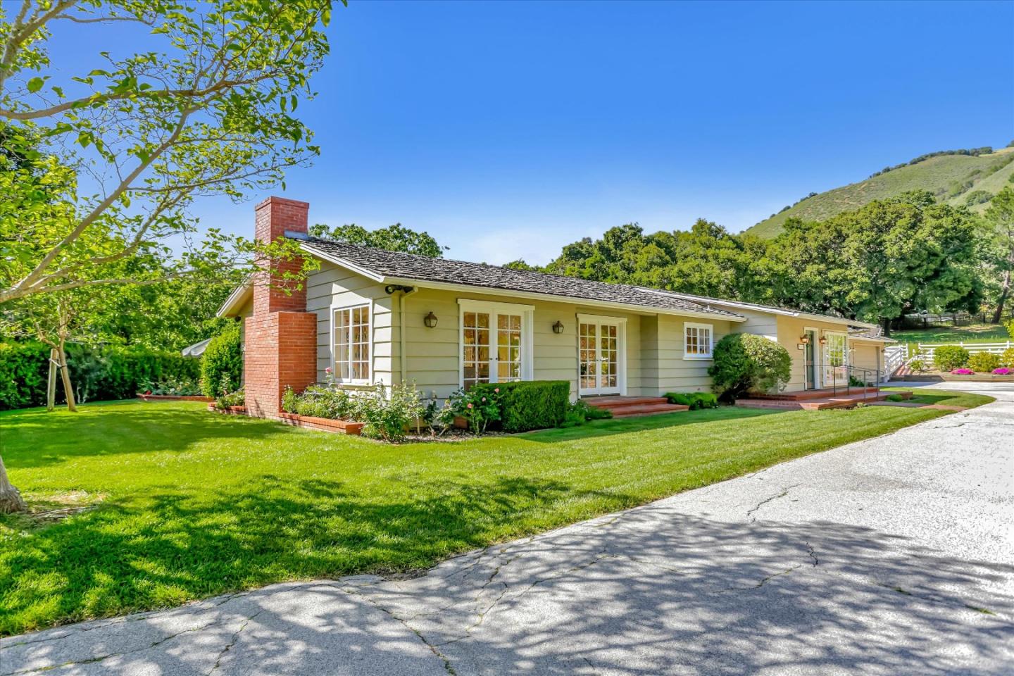 22 La Rancheria Carmel Valley, CA 93924 - Photo 1 of 44 a view of a house with a big yard plants and large trees