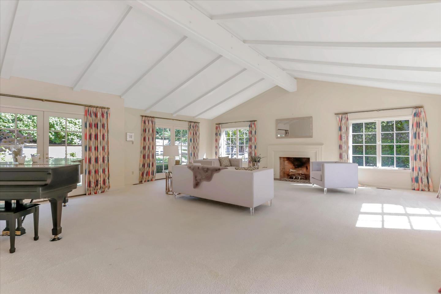 22 La Rancheria Carmel Valley, CA 93924 - Photo 13 of 44 a living room with furniture and a fireplace