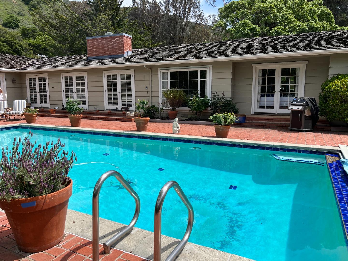 22 La Rancheria Carmel Valley, CA 93924 - Photo 2 of 44 a view of a house with swimming pool and porch