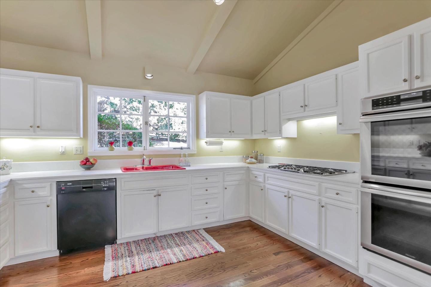 22 La Rancheria Carmel Valley, CA 93924 - Photo 21 of 44 a kitchen that has a sink and a stove in it