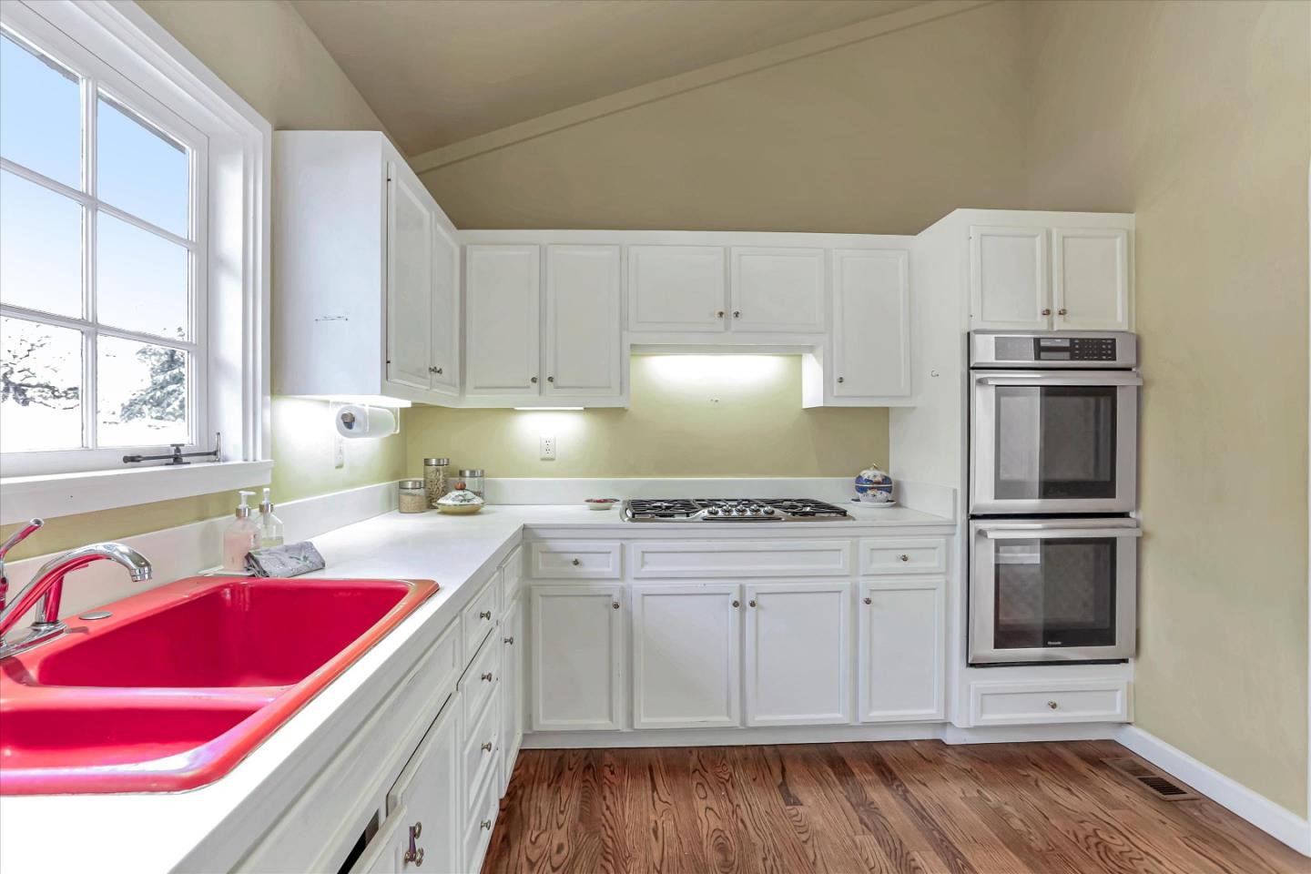 22 La Rancheria Carmel Valley, CA 93924 - Photo 22 of 44 a kitchen with cabinets appliances and wooden floor