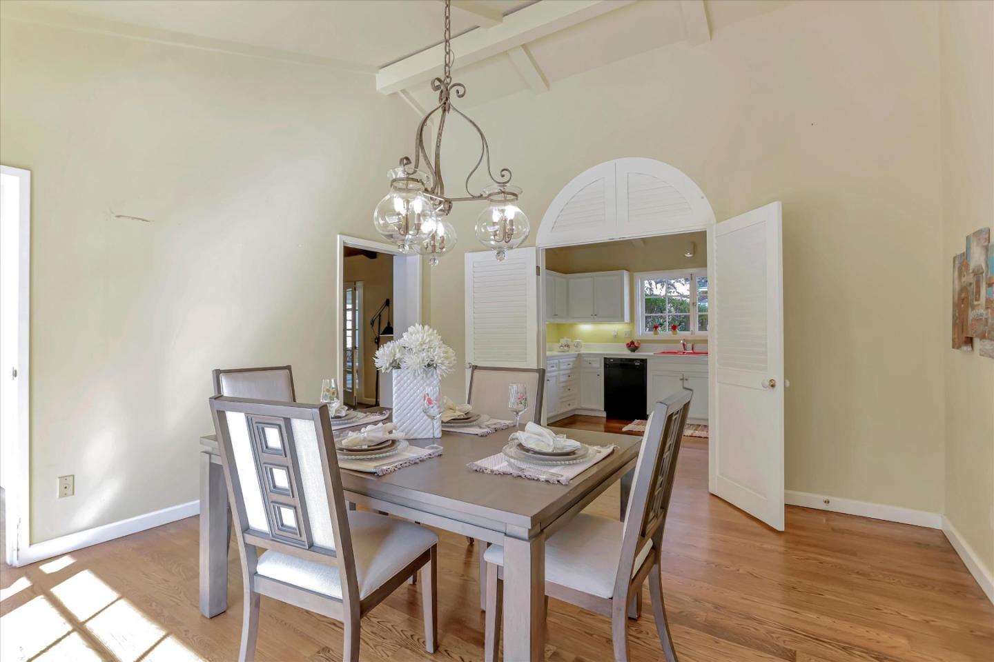 22 La Rancheria Carmel Valley, CA 93924 - Photo 25 of 44 a view of a dining room with furniture a chandelier and wooden floor