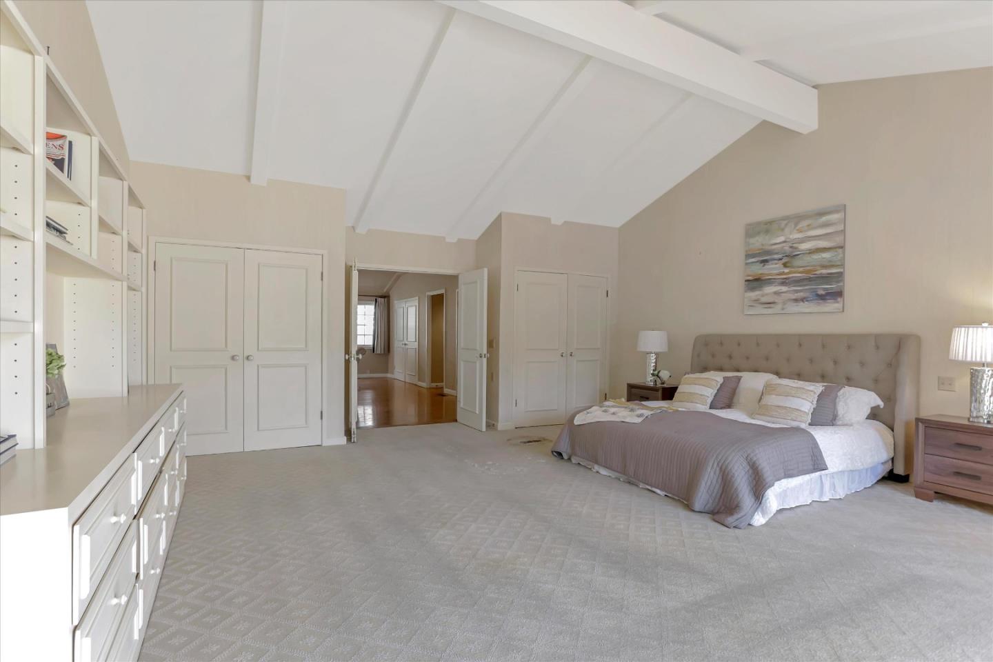 22 La Rancheria Carmel Valley, CA 93924 - Photo 30 of 44 a spacious bedroom with a bed and a cabinets