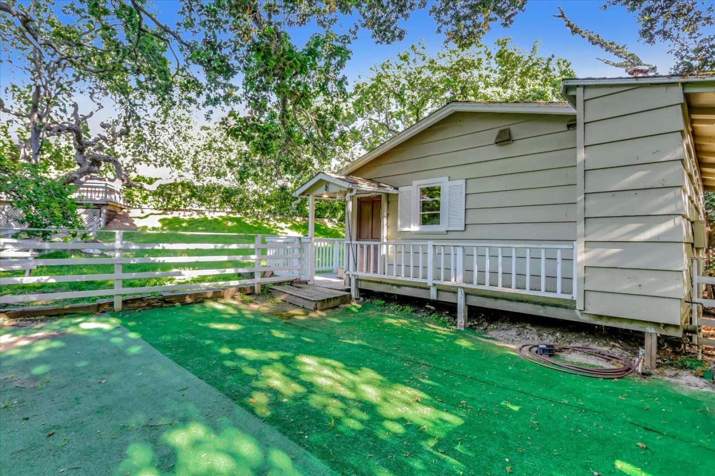 22 La Rancheria Carmel Valley, CA 93924 - Photo 38 of 44 a backyard of a house with barbeque oven and trees