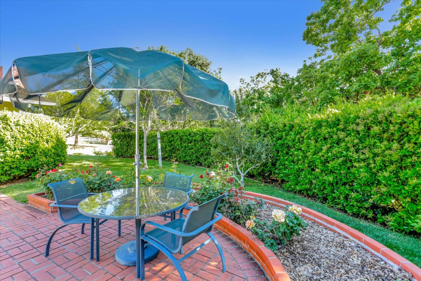 22 La Rancheria Carmel Valley, CA 93924 - Photo 41 of 44 a view of yard with furniture and umbrella
