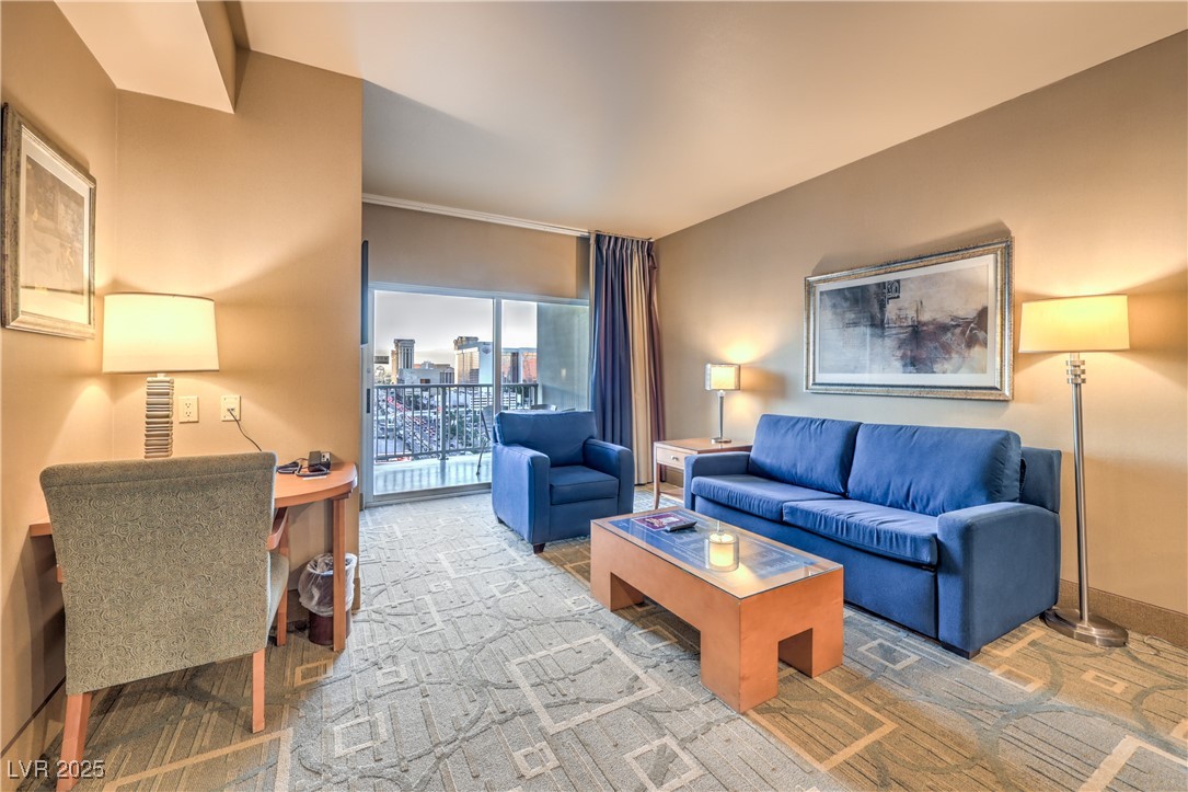 211 East Flamingo Road, Unit 1503 Las Vegas, NV 89169 - Photo 13 of 44 Living area with baseboards