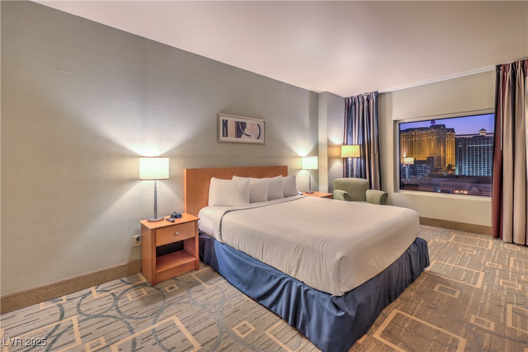 211 East Flamingo Road, Unit 1503 Las Vegas, NV 89169 - Photo 16 of 44 Carpeted bedroom featuring baseboards