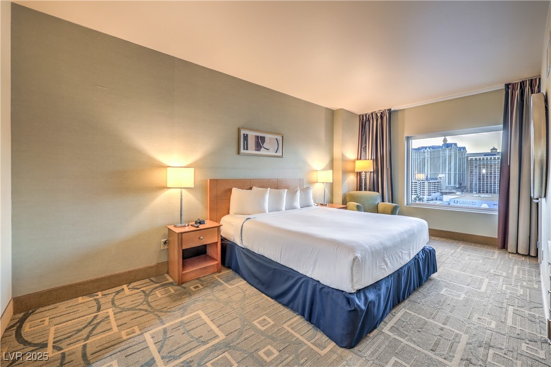 211 East Flamingo Road, Unit 1503 Las Vegas, NV 89169 - Photo 18 of 44 Carpeted bedroom featuring baseboards