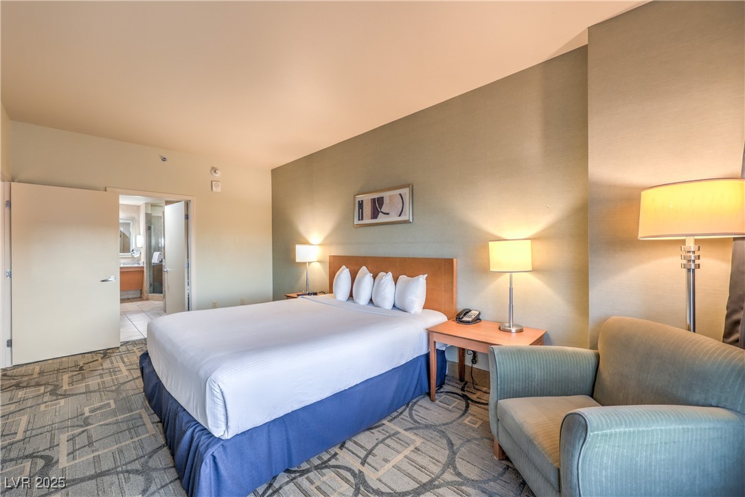 211 East Flamingo Road, Unit 1503 Las Vegas, NV 89169 - Photo 21 of 44 Carpeted bedroom with connected bathroom