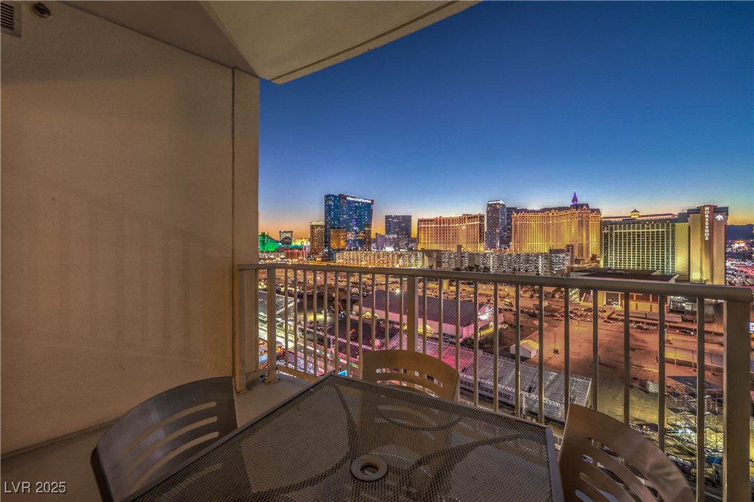 211 East Flamingo Road, Unit 1503 Las Vegas, NV 89169 - Photo 27 of 44 Balcony at dusk featuring a view of city