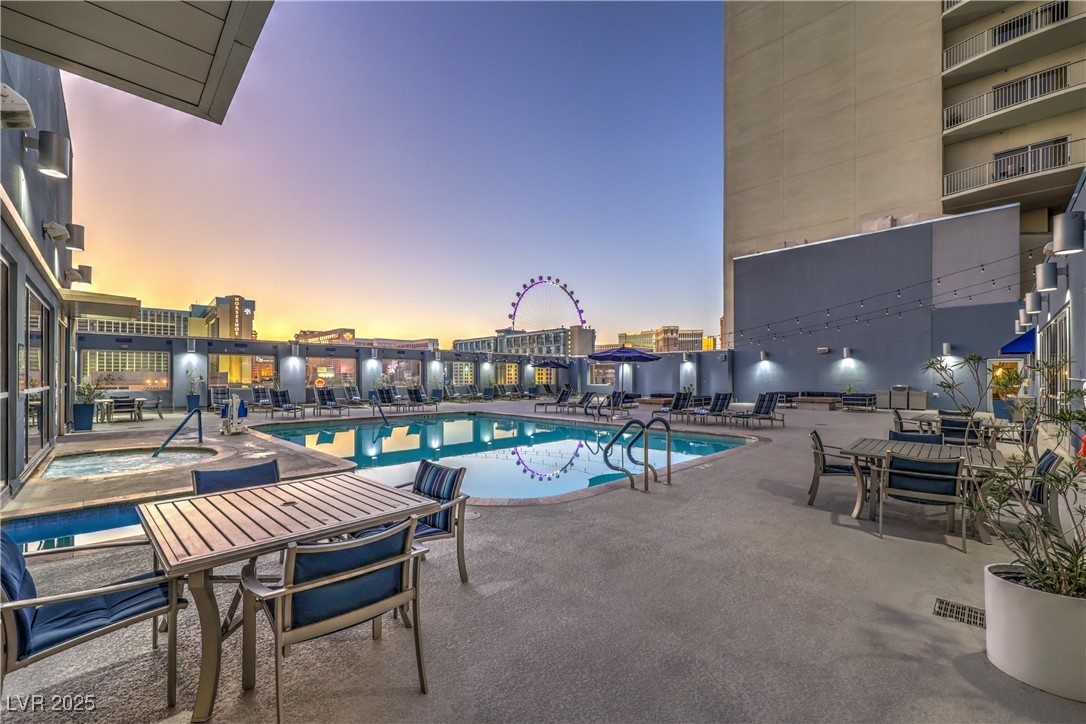 211 East Flamingo Road, Unit 1503 Las Vegas, NV 89169 - Photo 38 of 44 Community pool featuring a patio and outdoor dining space