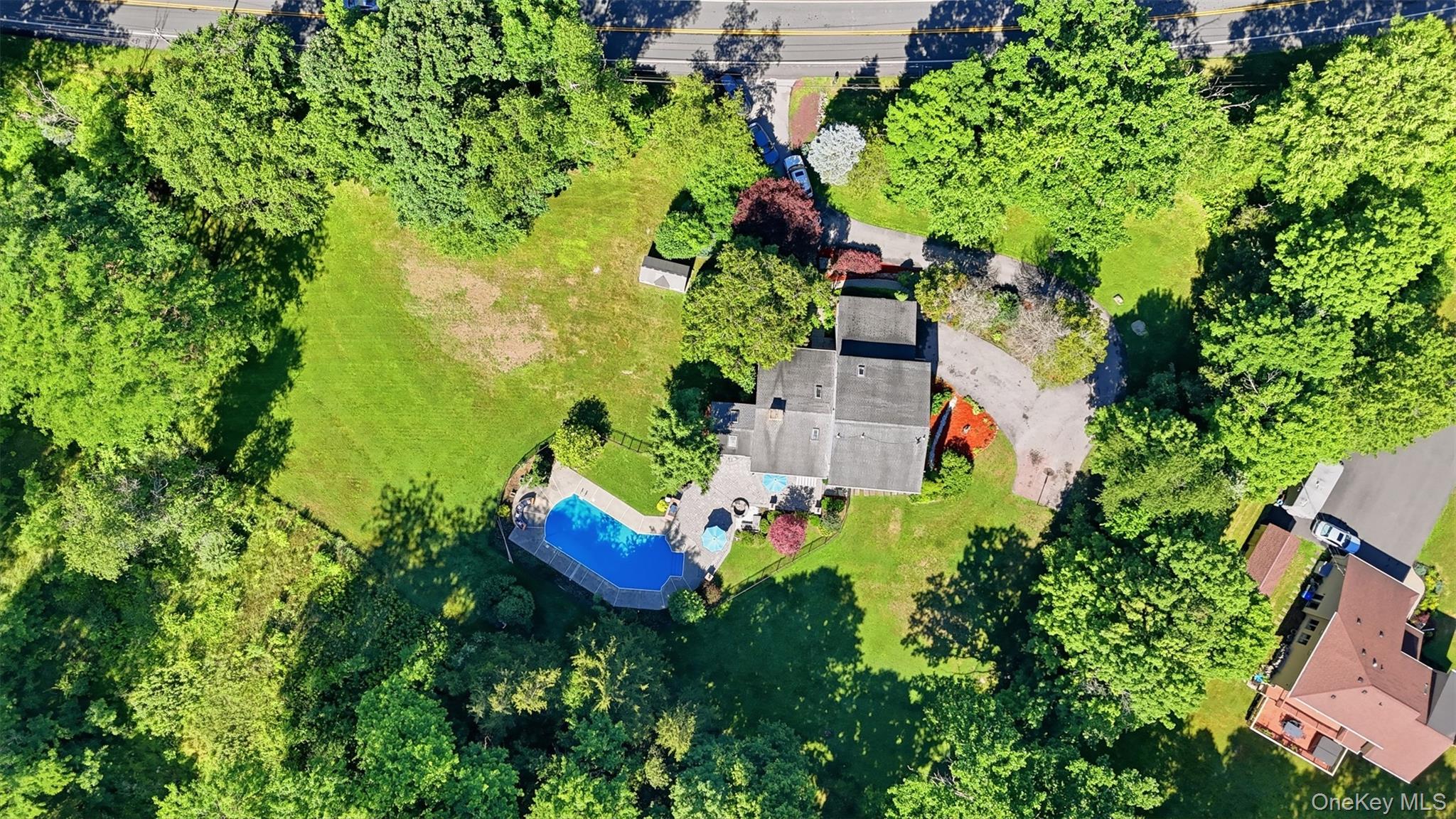 985 Craigville Road Chester, NY 10918 - Photo 31 of 36 Expansive property featuring a private swimming pool, surrounding patio, and a separate outbuilding