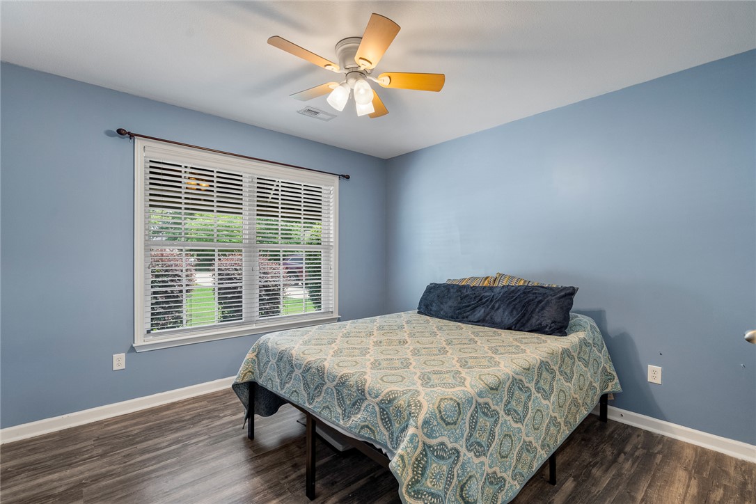 167 Mediterranean Avenue Anderson, SC 29621 - Photo 25 of 33 Well-lit sleeping quarters with a cooling ceiling fan and durable flooring.